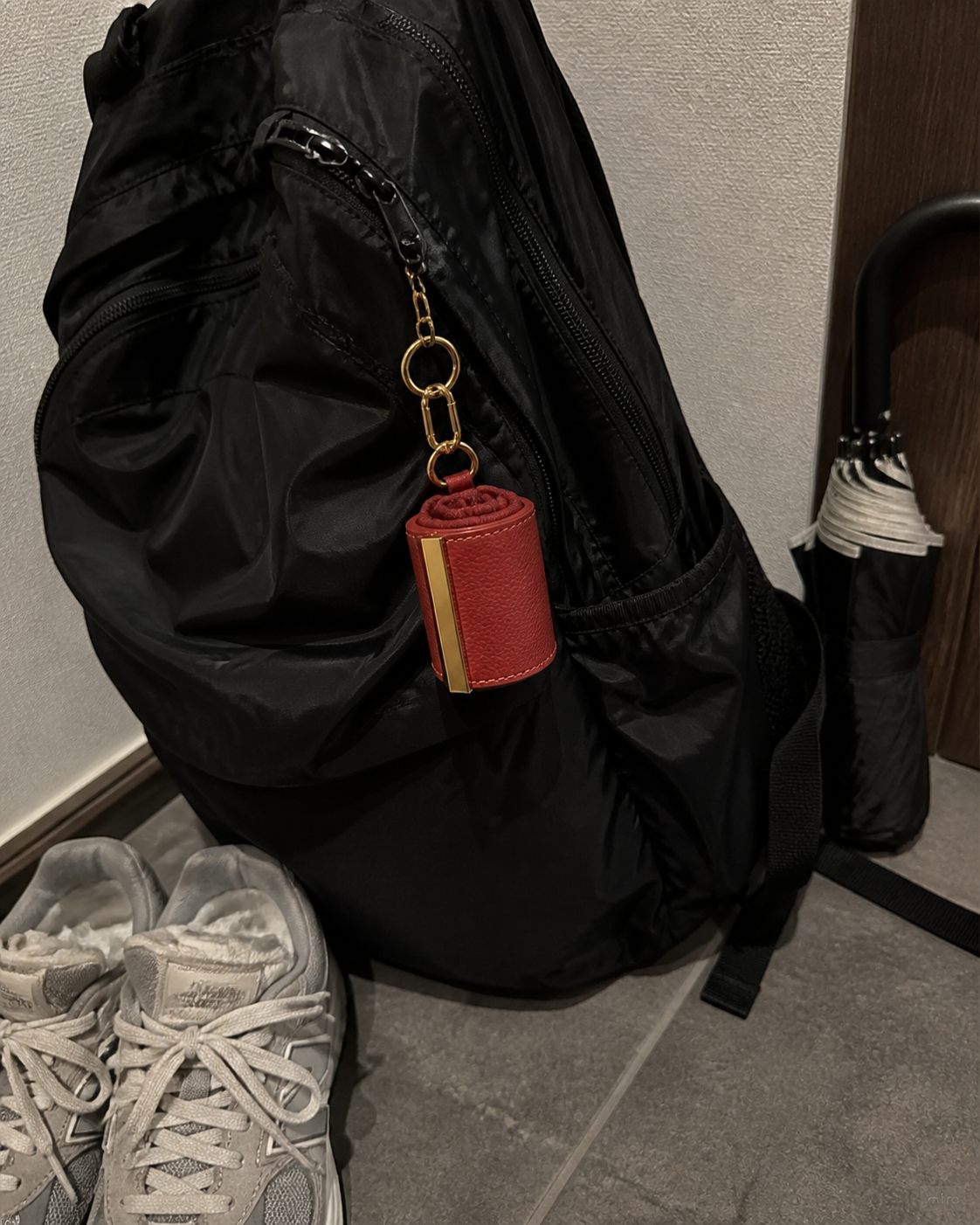 Red charm on a backpack