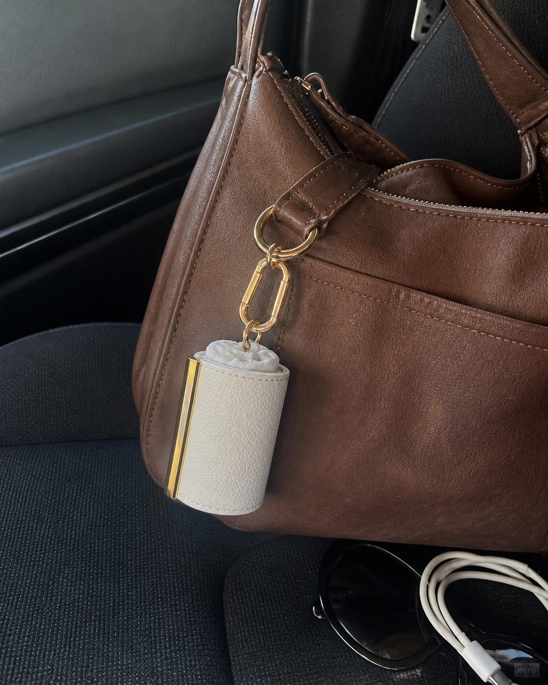 White charm on a handbag