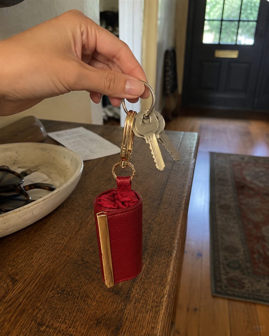 Red charm on keys at home
